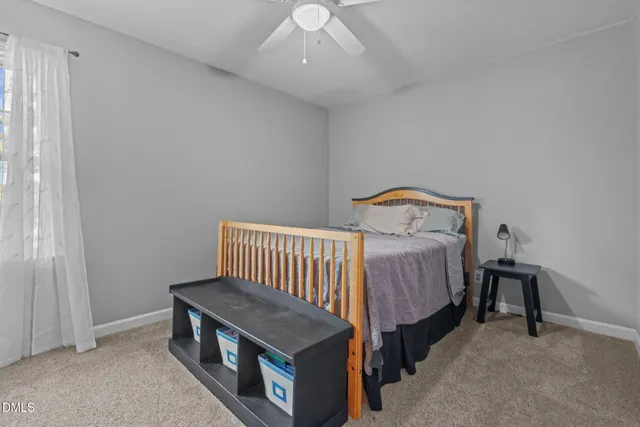 a bathroom with a sink mirror vanity and toilet