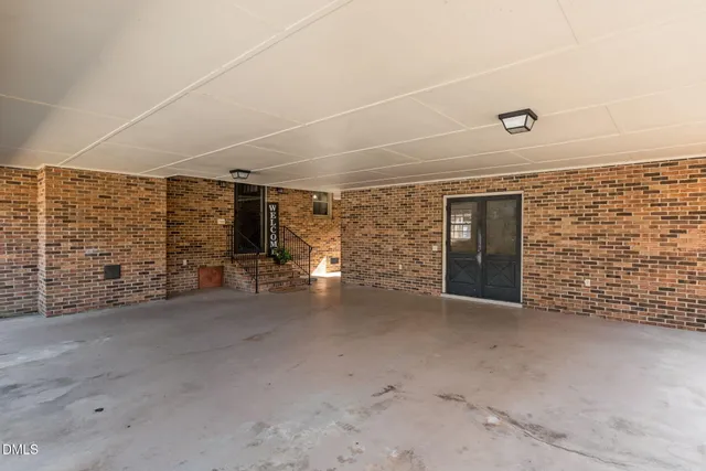 an aerial view of a house with a swimming pool