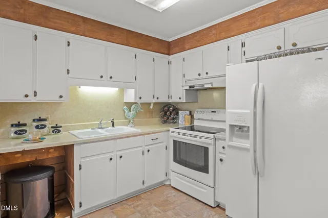 a swimming pool with outdoor seating and yard