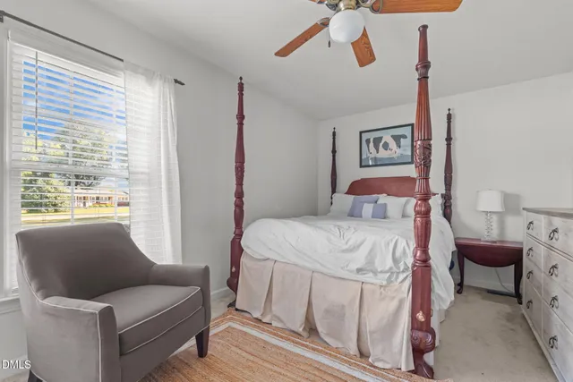 a view of a house with a backyard and a patio