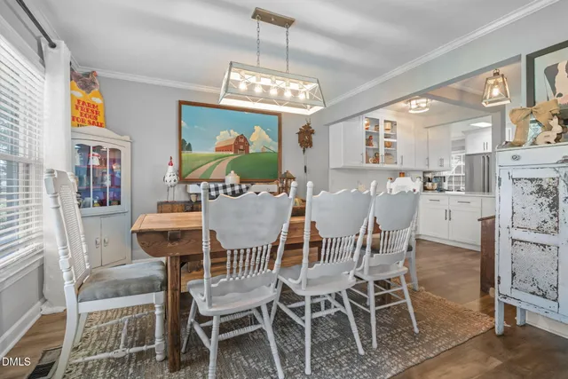 a kitchen with a stove a sink and a refrigerator