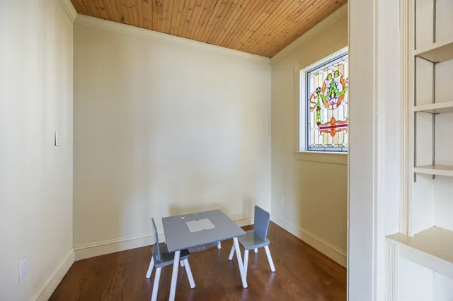 an empty room with closet and a flat screen tv