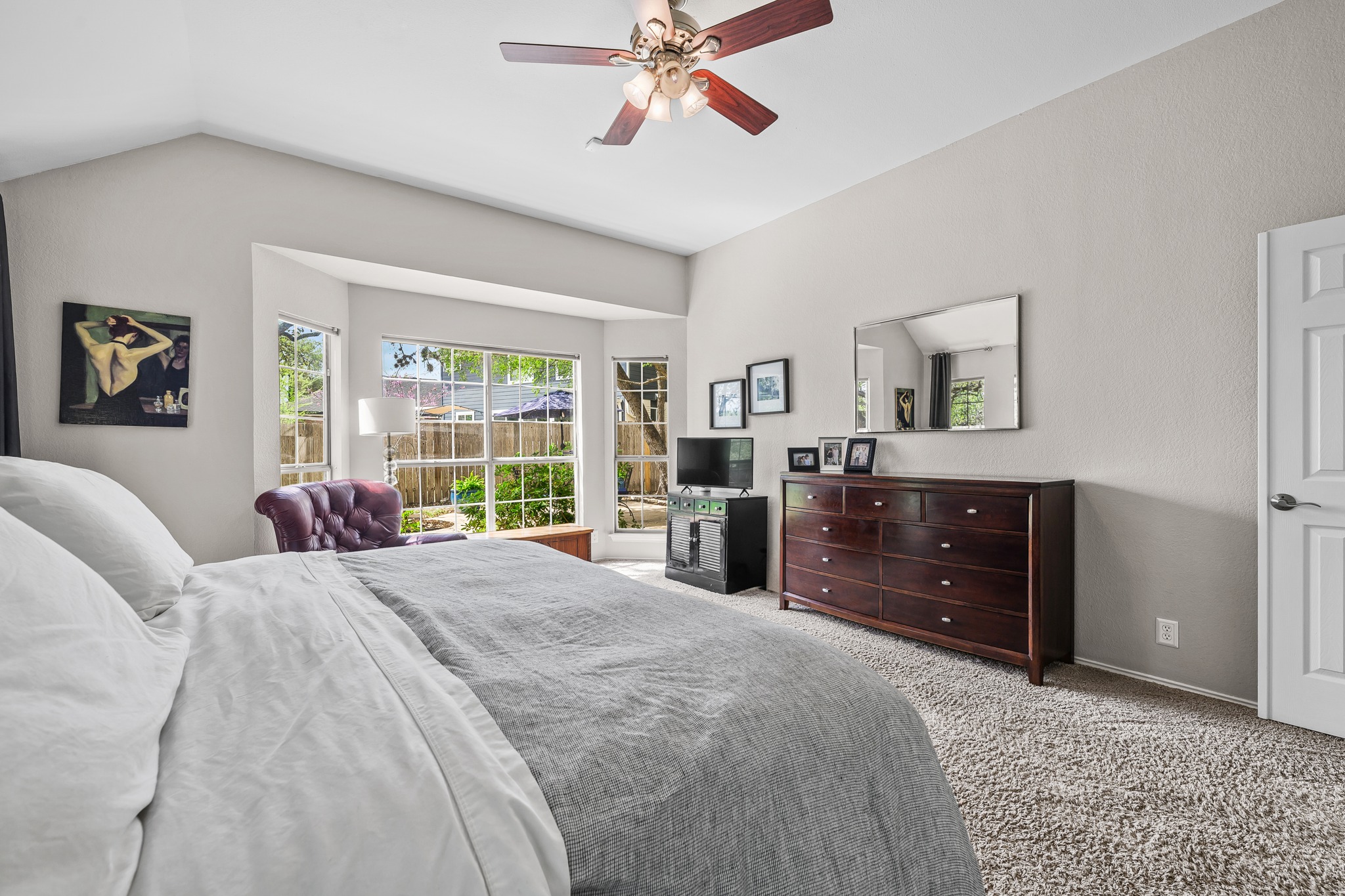4801 Counts Cove Austin, TX 78749 - Photo 16 of 40 a bedroom with a bed large window and wall painting