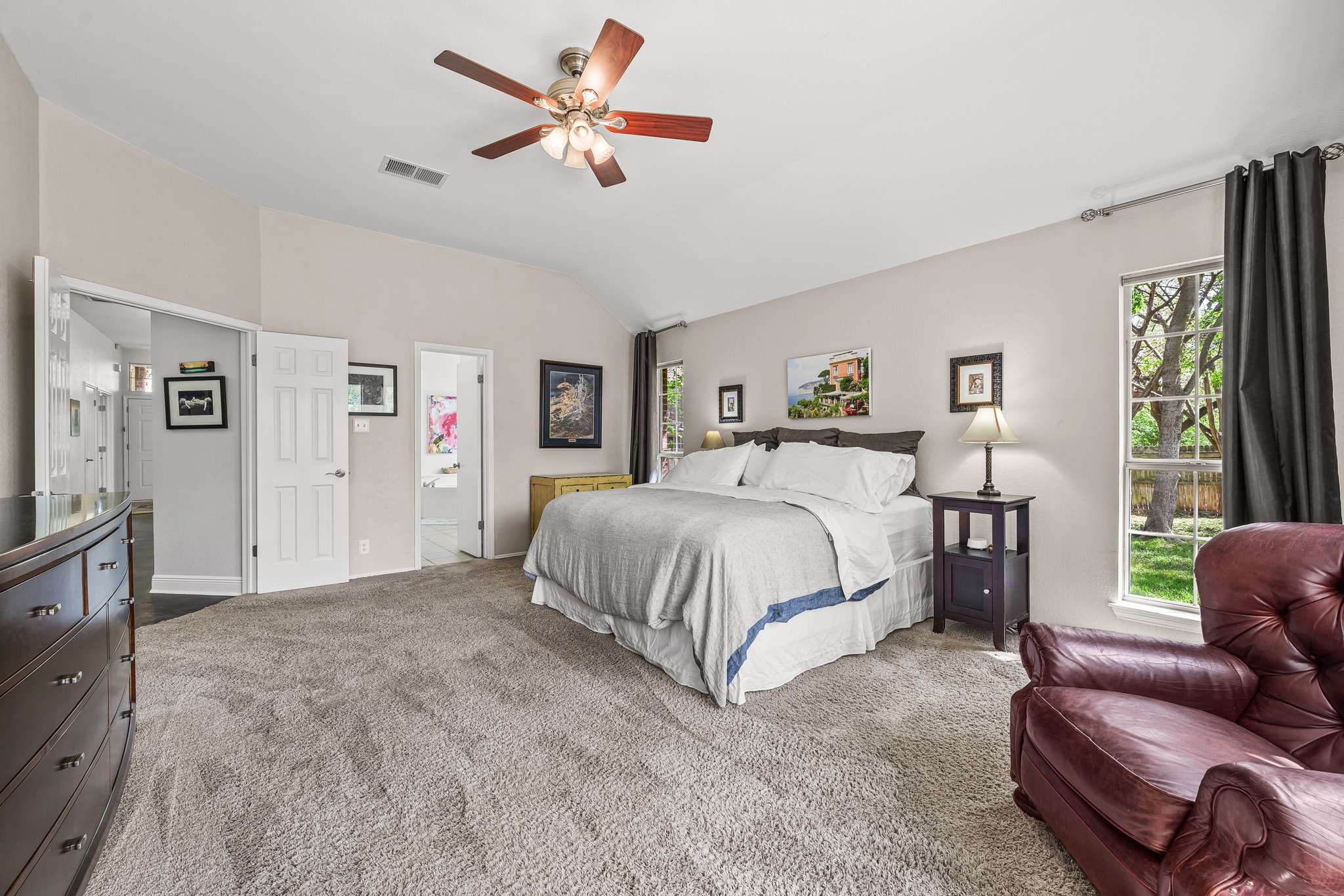 4801 Counts Cove Austin, TX 78749 - Photo 17 of 40 a spacious bedroom with a bed couch and a window