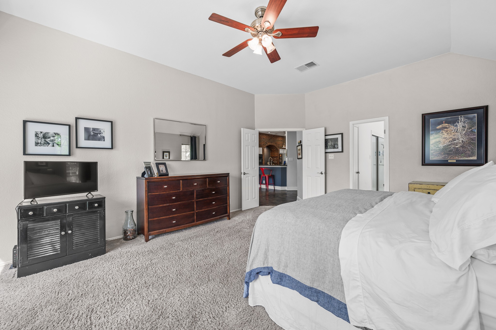 4801 Counts Cove Austin, TX 78749 - Photo 18 of 40 a spacious bedroom with a bed and a flat screen tv