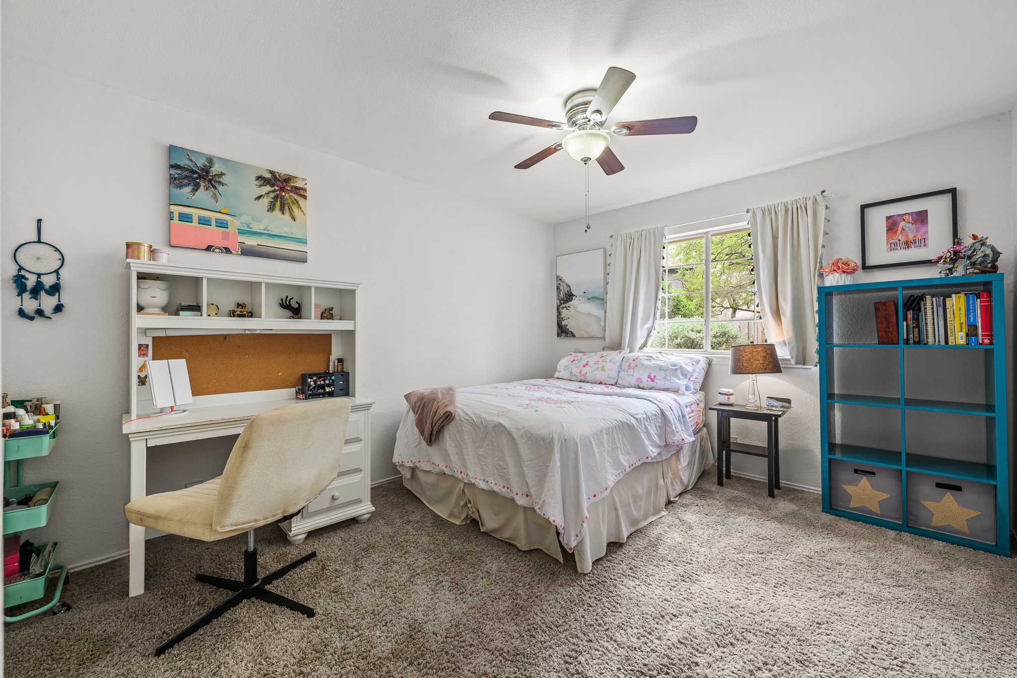 4801 Counts Cove Austin, TX 78749 - Photo 20 of 40 a spacious bedroom with a bed a table and painting on the wall