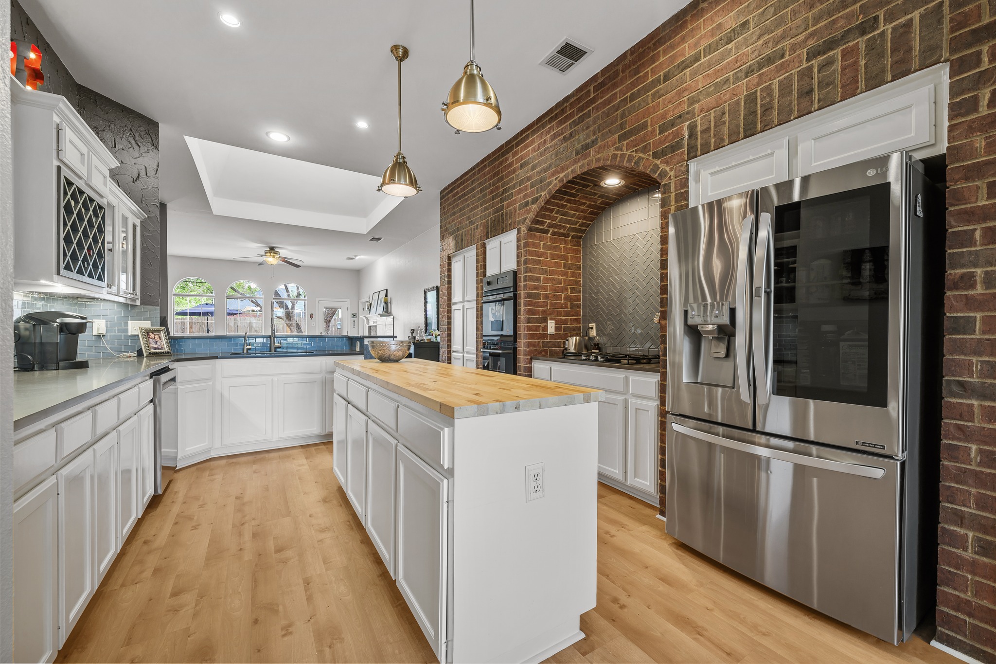 4801 Counts Cove Austin, TX 78749 - Photo 4 of 40 a kitchen with stainless steel appliances a sink and a refrigerator