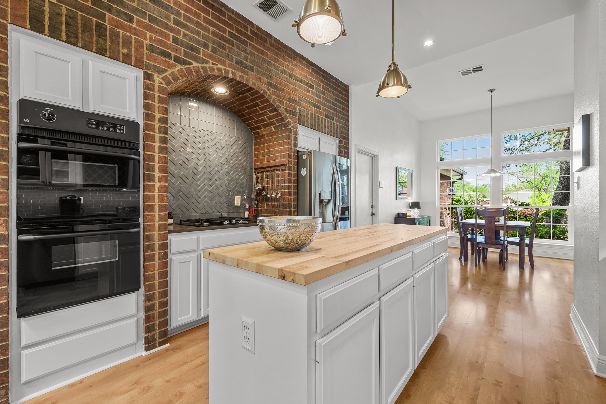 4801 Counts Cove Austin, TX 78749 - Photo 5 of 40 a kitchen with a stove kitchen island and stainless steel appliances