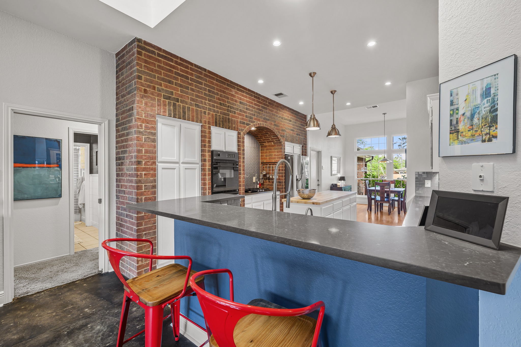4801 Counts Cove Austin, TX 78749 - Photo 8 of 40 a kitchen with stainless steel appliances kitchen island granite countertop a sink and cabinets