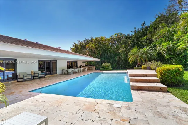 a kitchen with furniture a stove top oven and sink