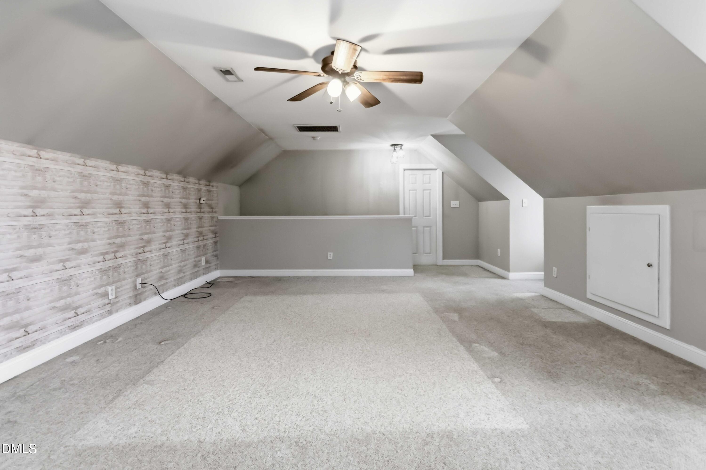 226 Fletcher Ridge Road Timberlake, NC 27583 - Photo 22 of 30 en empty room with windows and ceiling fan