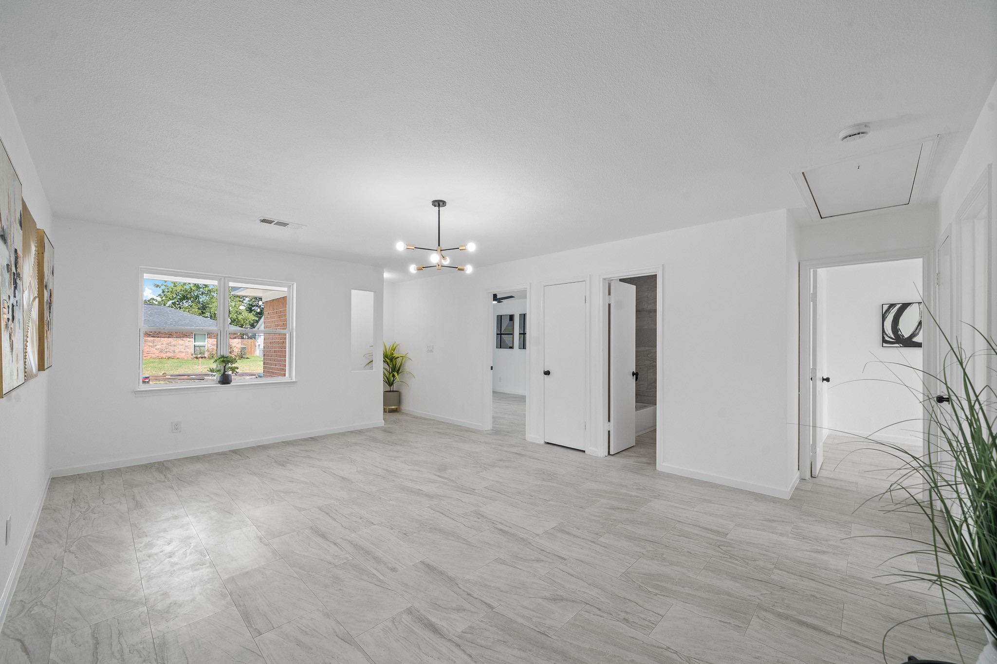 15415 West Hampton Circle Houston, TX 77071 - Photo 11 of 35 an empty room with windows and ceiling fan
