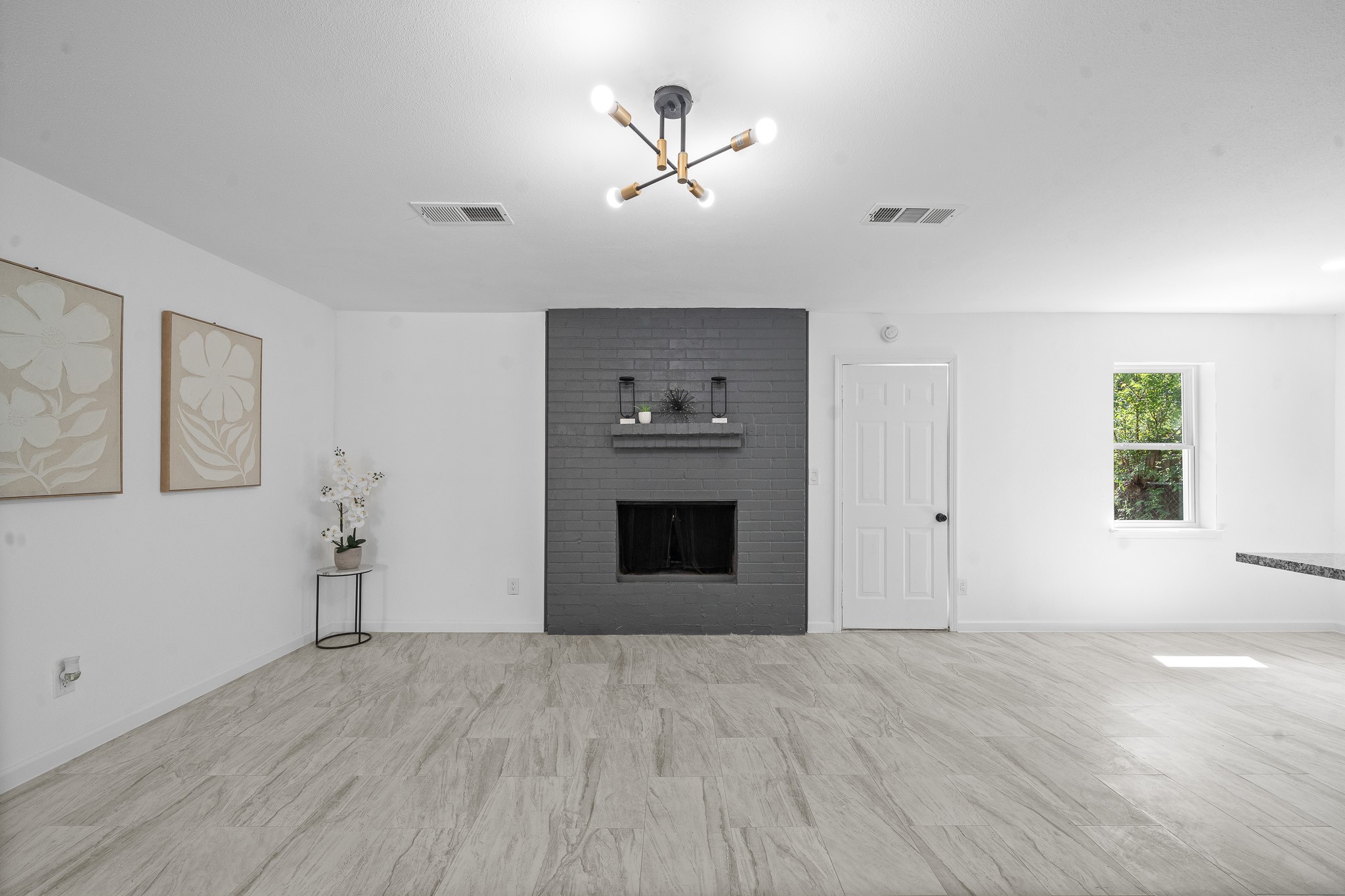 15415 West Hampton Circle Houston, TX 77071 - Photo 14 of 35 a view of empty room with a fireplace and wooden floor