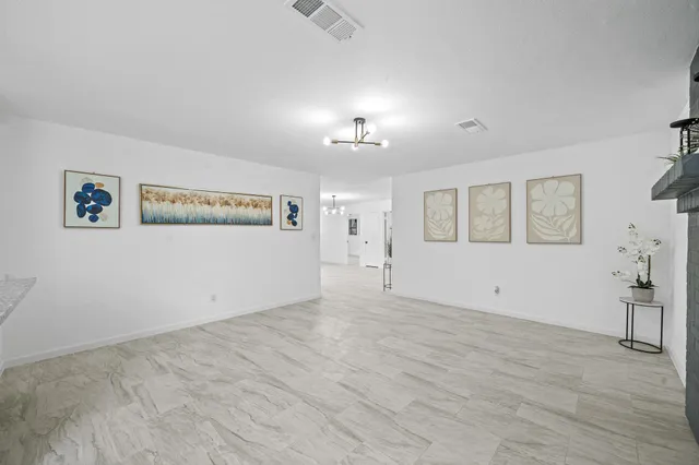 a view of a room with gym equipment and windows