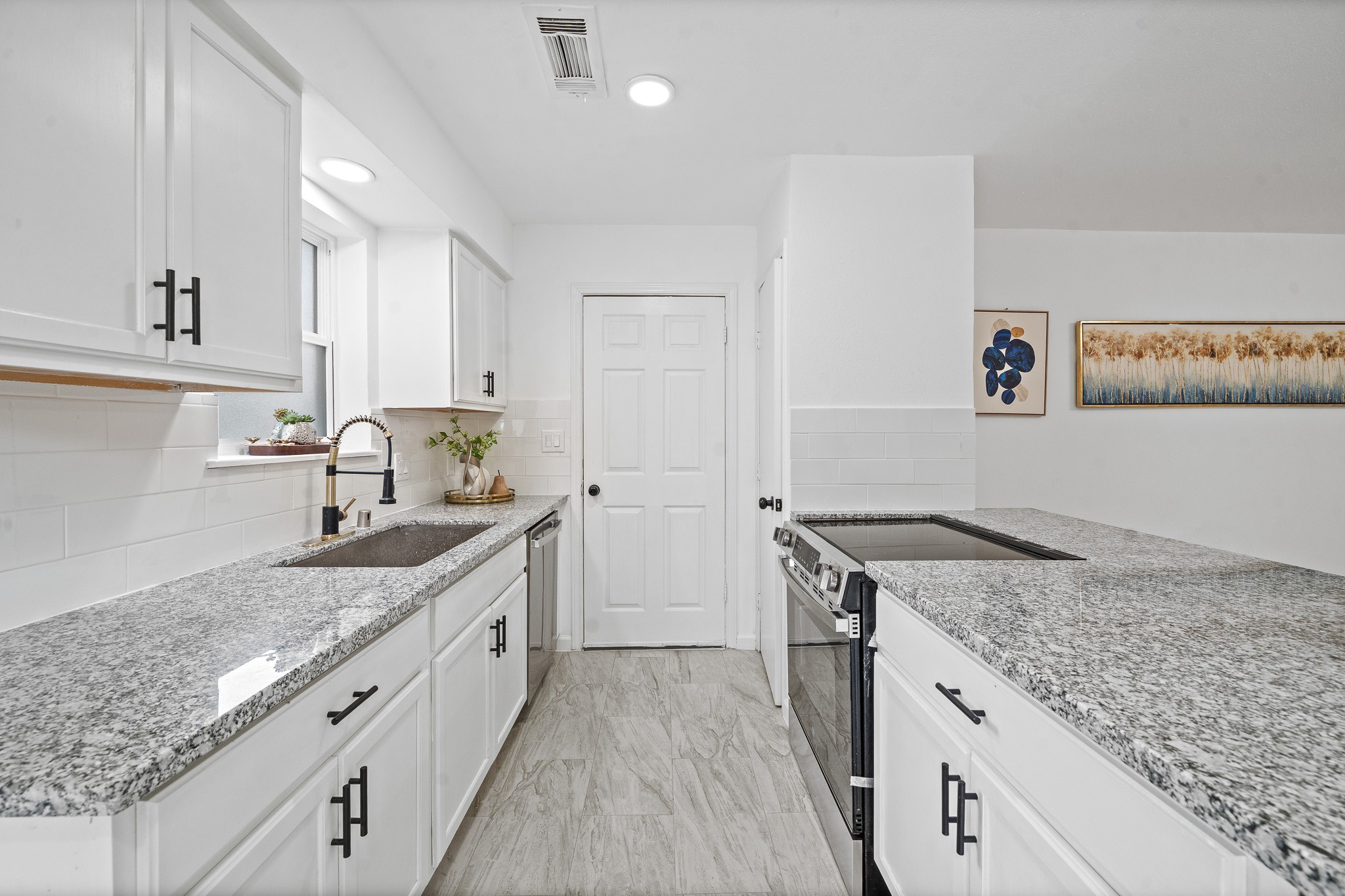 15415 West Hampton Circle Houston, TX 77071 - Photo 20 of 35 a kitchen with a granite countertop sink and cabinets