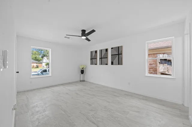 a view of an empty room with a window