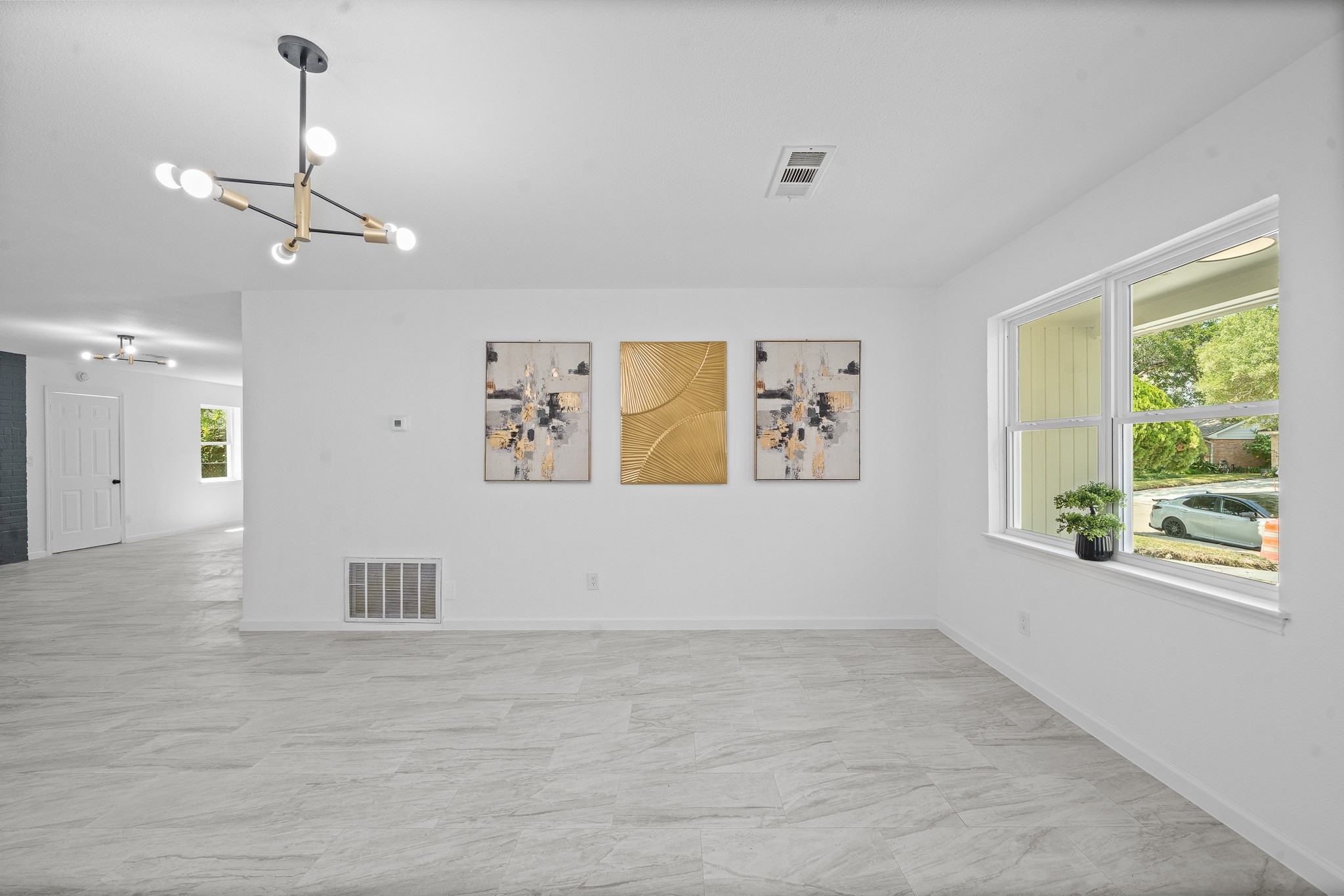 15415 West Hampton Circle Houston, TX 77071 - Photo 7 of 35 a view of empty room with window and ceiling fan