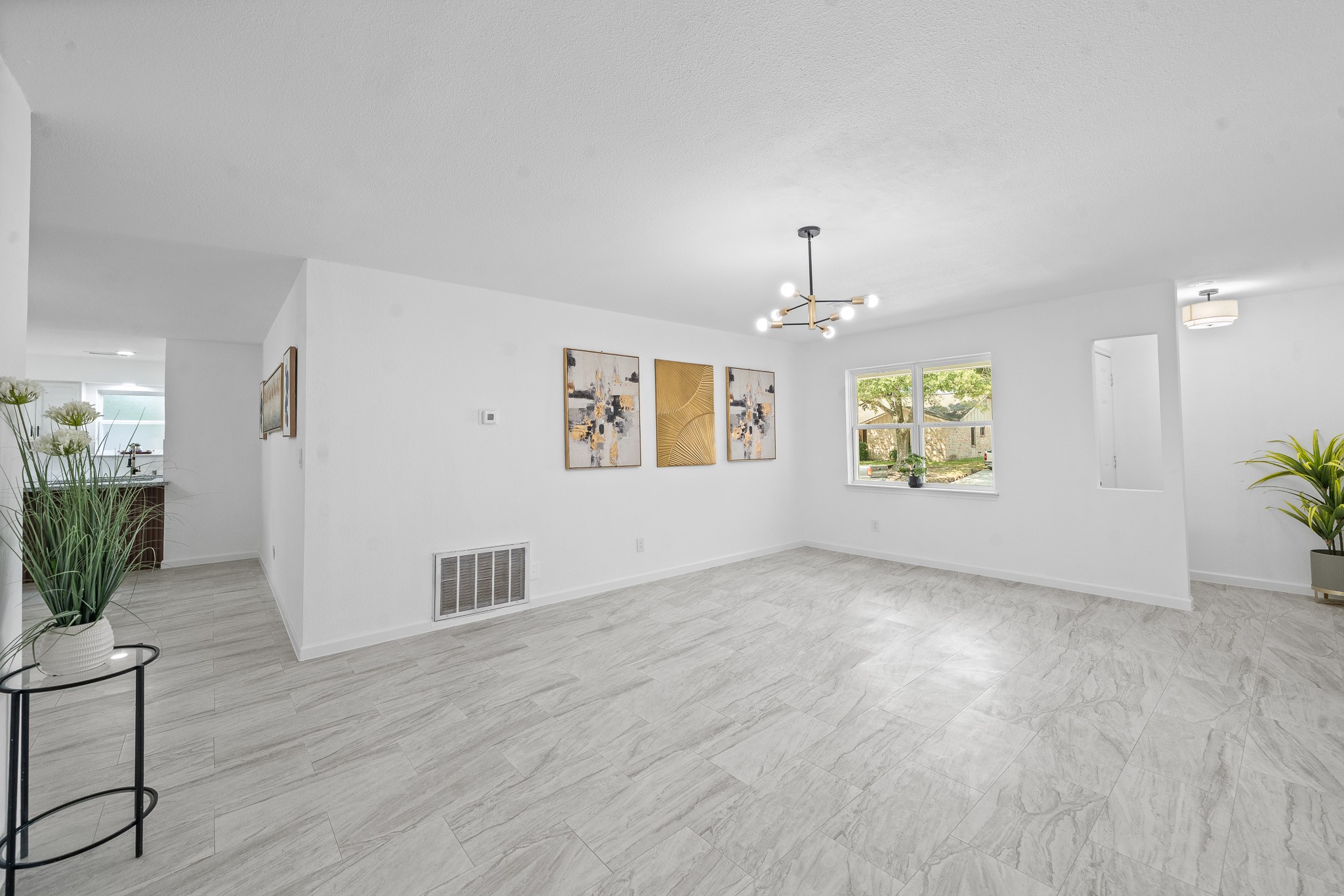 15415 West Hampton Circle Houston, TX 77071 - Photo 8 of 35 an empty room with windows and cabinet