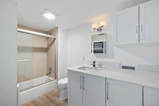 a bathroom with a bathtub and a sink