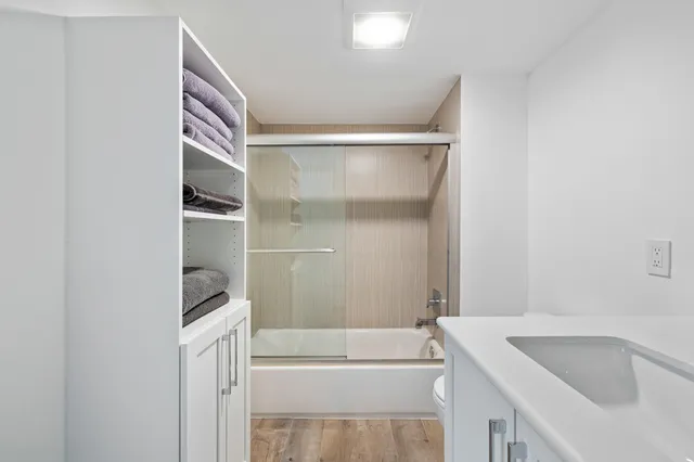 a view of a bathroom with washing machine and sink