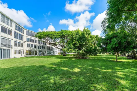 a view of a big yard with a big yard and large trees