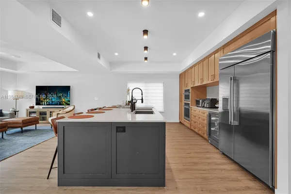 a view of a livingroom with furniture and wooden floor