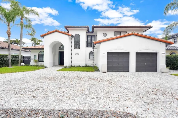 a view of white house with a yard