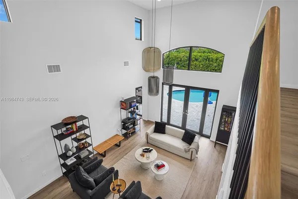 a bedroom with a bed and a mirror