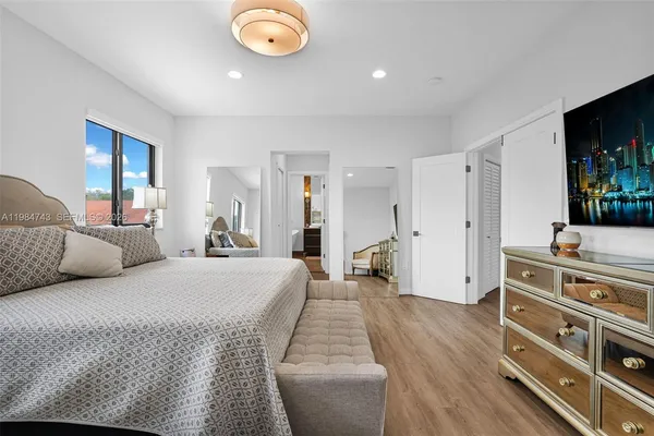 a view of a workspace with furniture and wooden floor
