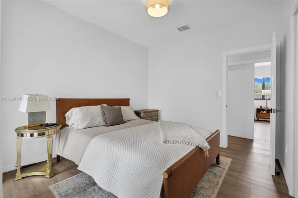 a view of a house with swimming pool and sitting area