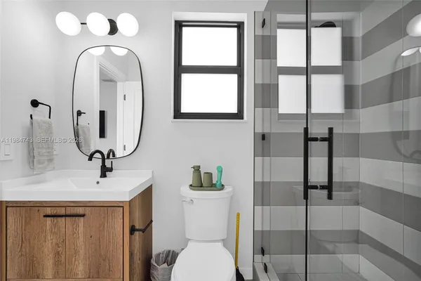 an aerial view of residential houses with outdoor space and street view