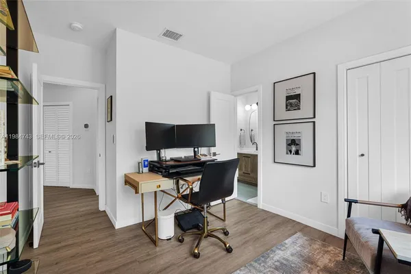 an aerial view of residential houses with city view