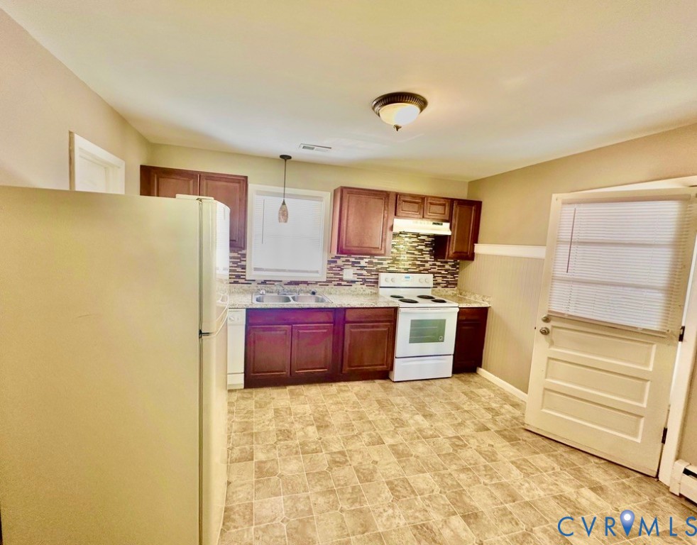 1024 Bolton Road Richmond, VA 23225 - Photo 6 of 13 Kitchen and door to back lawn