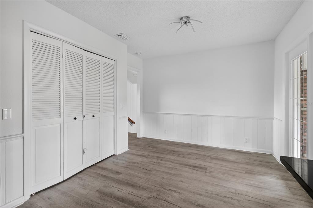 148 Lake Otis Road Winter Haven, FL 33884 - Photo 14 of 44 wooden floor in an empty room