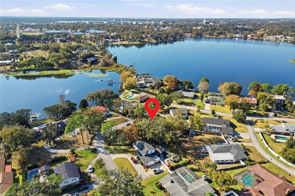 148 Lake Otis Road Winter Haven, FL 33884 - Photo 2 of 44 an aerial view of lake residential houses with outdoor space and ocean view