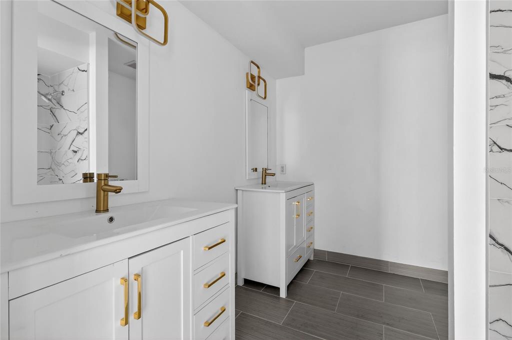 148 Lake Otis Road Winter Haven, FL 33884 - Photo 23 of 44 a bathroom with a sink and a mirror