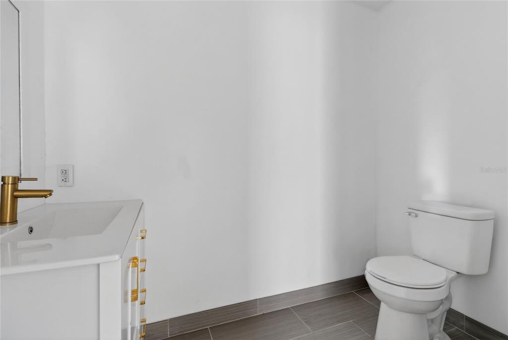148 Lake Otis Road Winter Haven, FL 33884 - Photo 25 of 44 a bathroom with a sink and a toilet