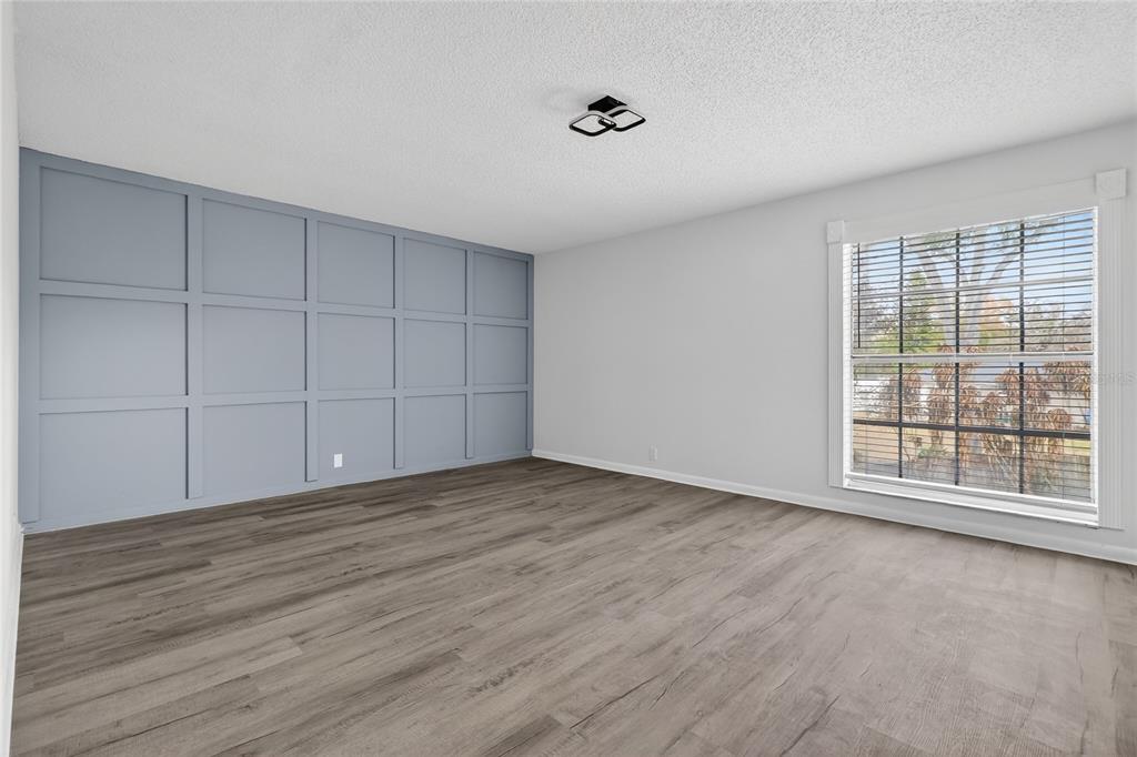 148 Lake Otis Road Winter Haven, FL 33884 - Photo 32 of 44 wooden floor in an empty room with a window