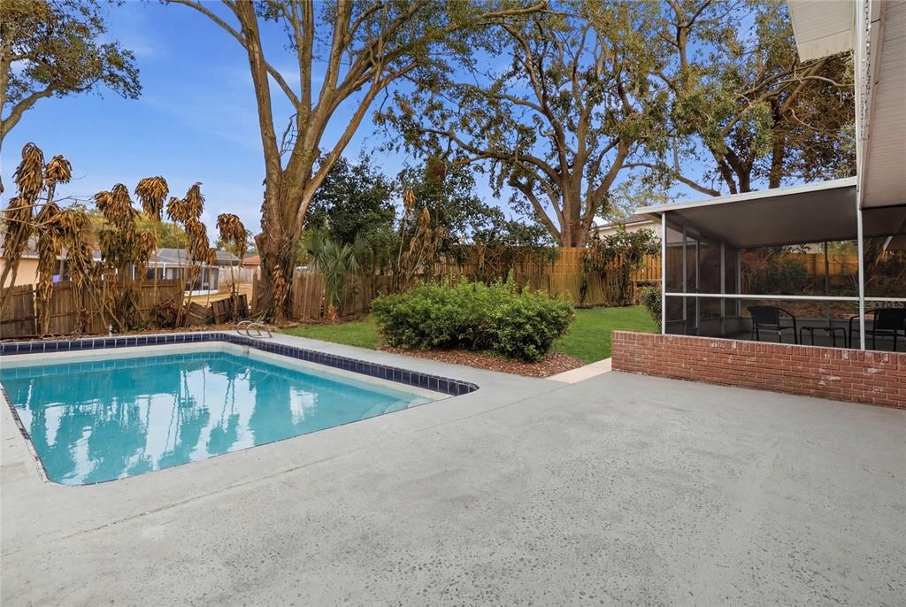 148 Lake Otis Road Winter Haven, FL 33884 - Photo 40 of 44 a view of a backyard with a large tree