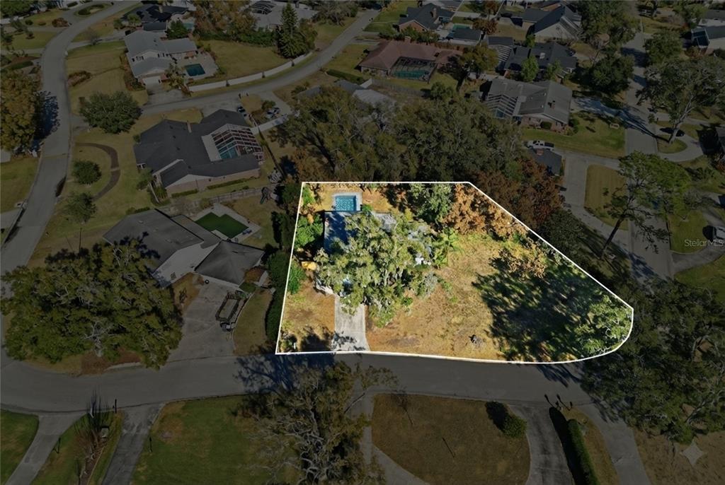 148 Lake Otis Road Winter Haven, FL 33884 - Photo 41 of 44 an aerial view of a house with a yard