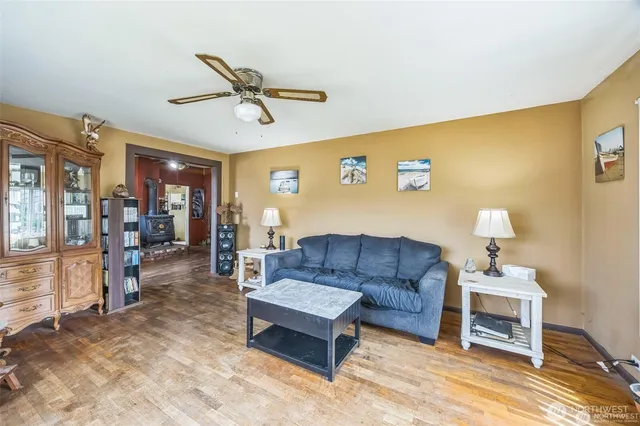 a living room with furniture and kitchen view