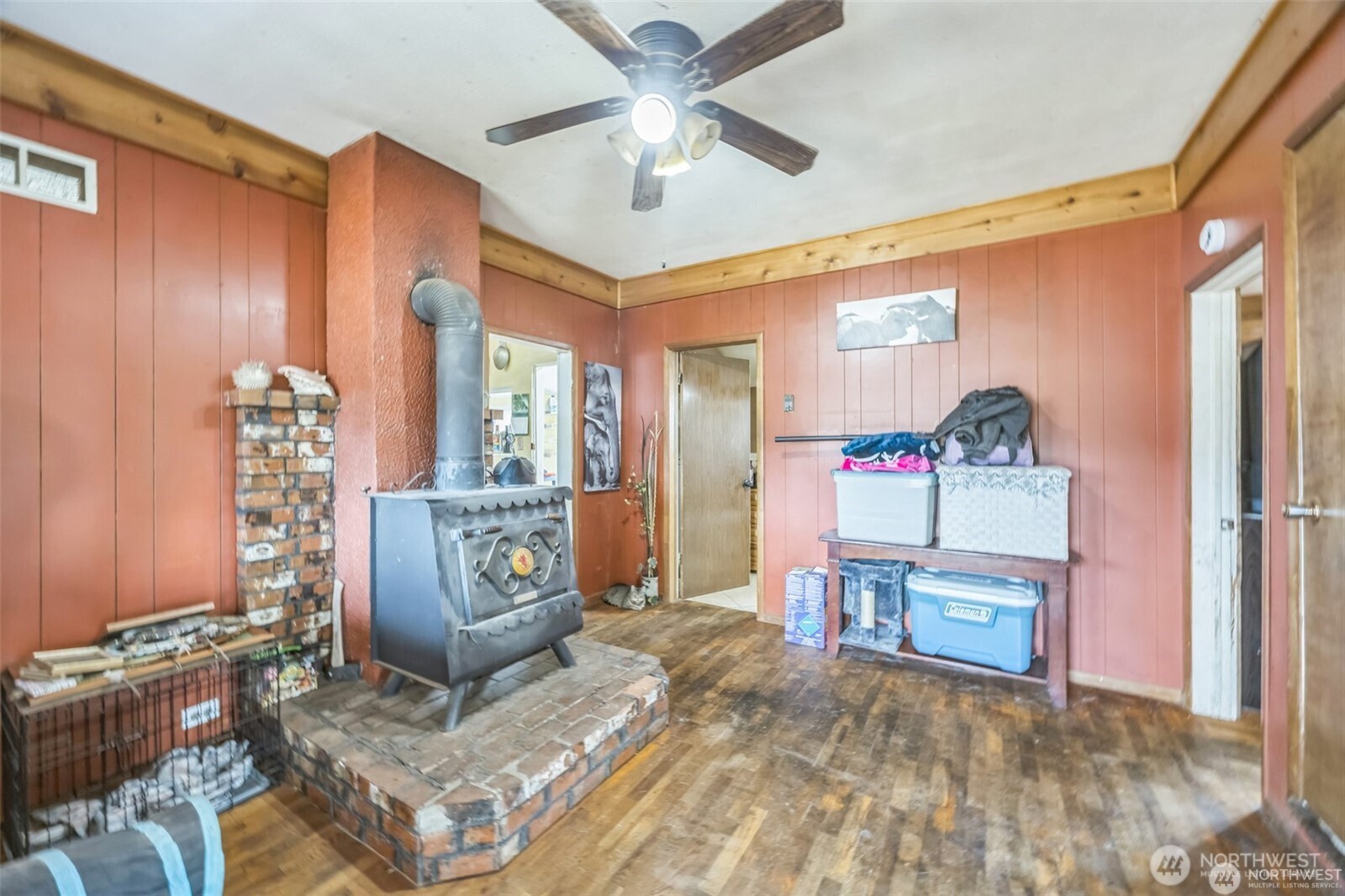 112 South 2nd Street Pe Ell, WA 98572 - Photo 5 of 12 a living room with a couch and a chandelier