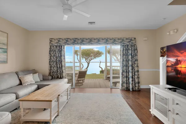 a view of a balcony with wooden floor