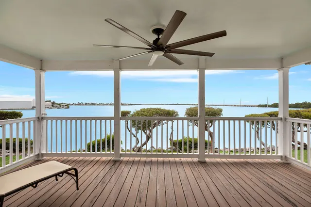 a bedroom with a bed and a night stand