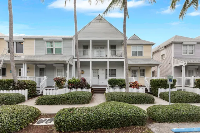 a view of a lake with lawn chairs