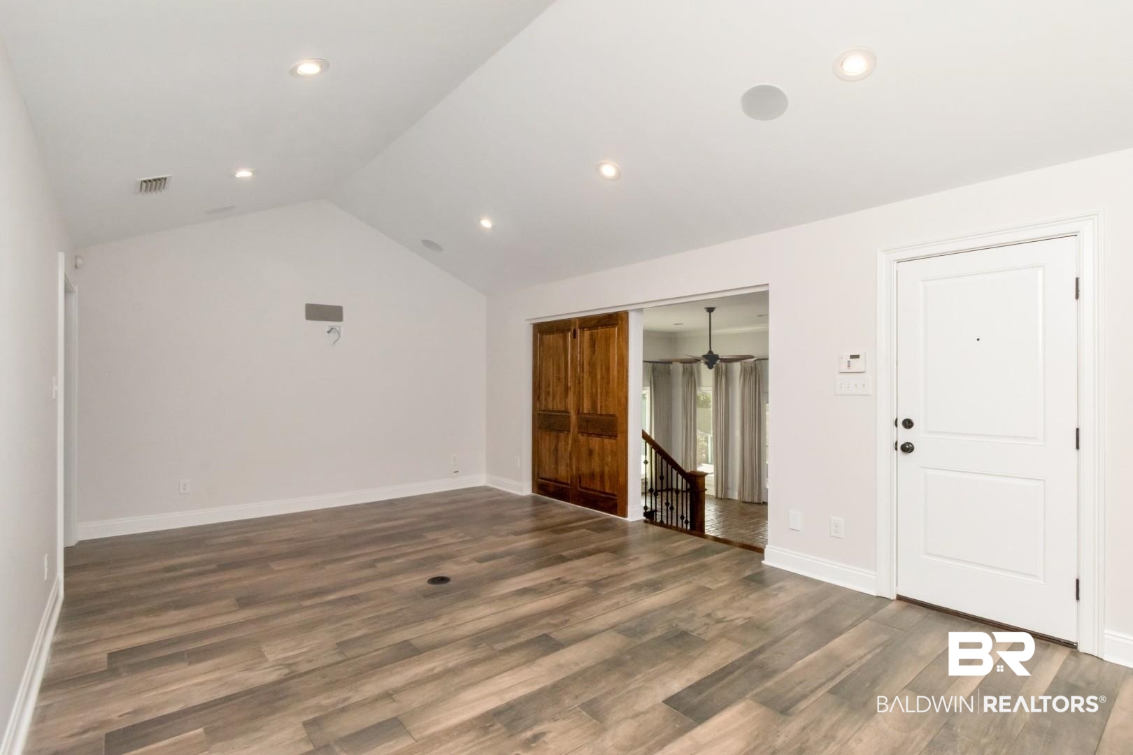 231 Rochester Road Mobile, AL 36608 - Photo 13 of 51 Empty room featuring dark wood-type flooring and recessed lighting