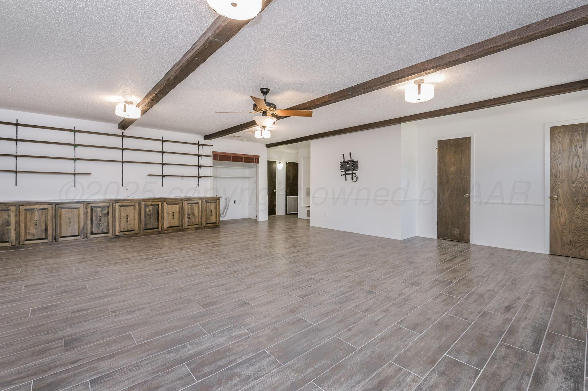 1102 Creekmere Drive Canyon, TX 79015 - Photo 13 of 29 a view of a livingroom with furniture and wooden floor