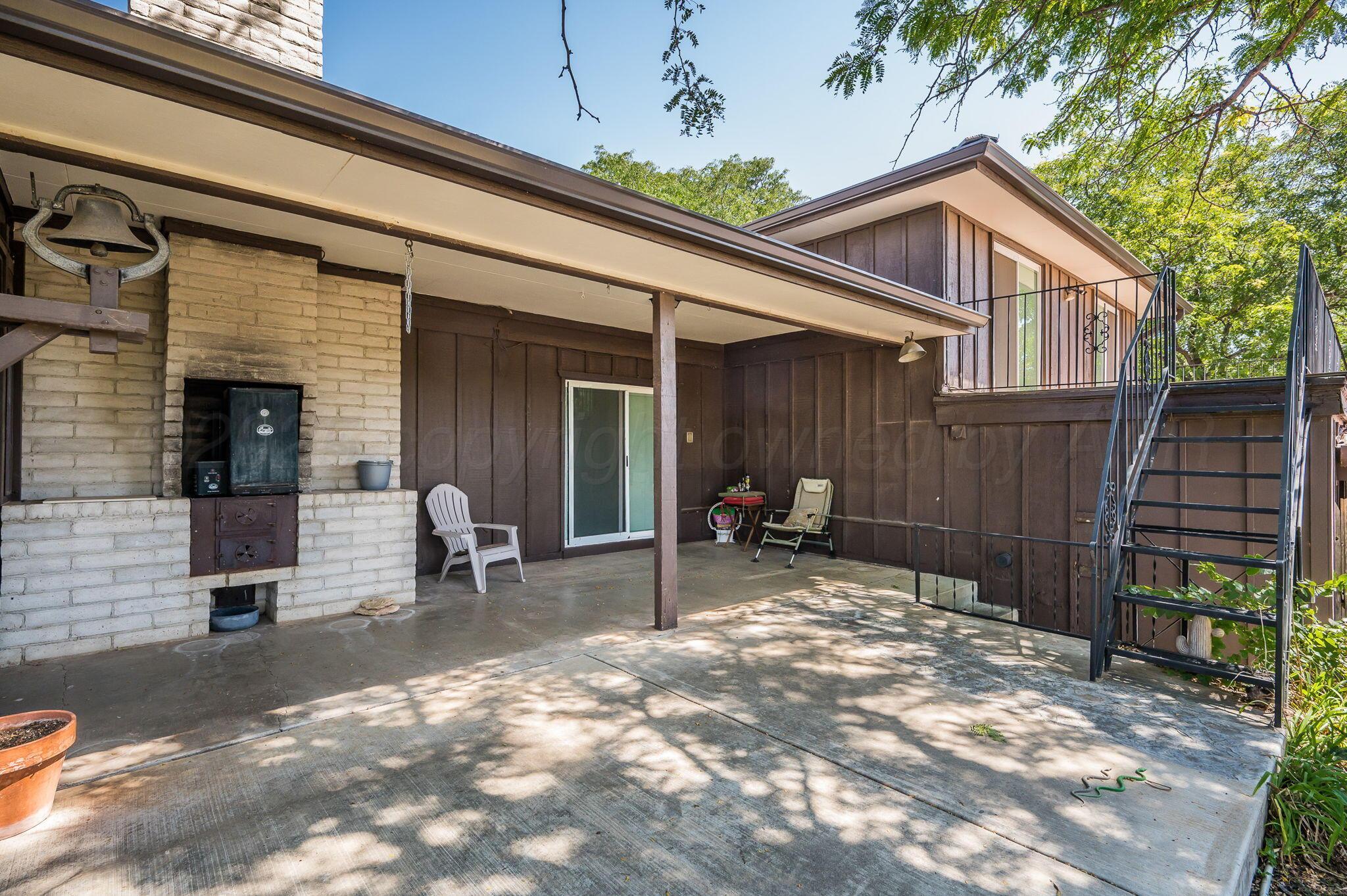 1102 Creekmere Drive Canyon, TX 79015 - Photo 27 of 29 a view of a house with backyard and sitting area