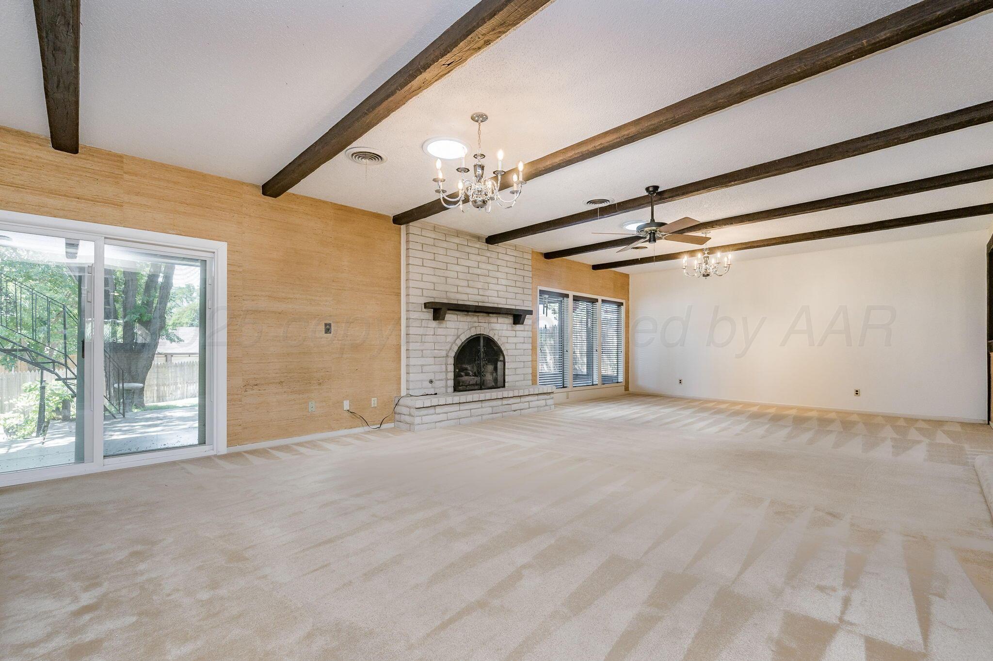 1102 Creekmere Drive Canyon, TX 79015 - Photo 3 of 29 a view of a livingroom with an empty space and a fireplace
