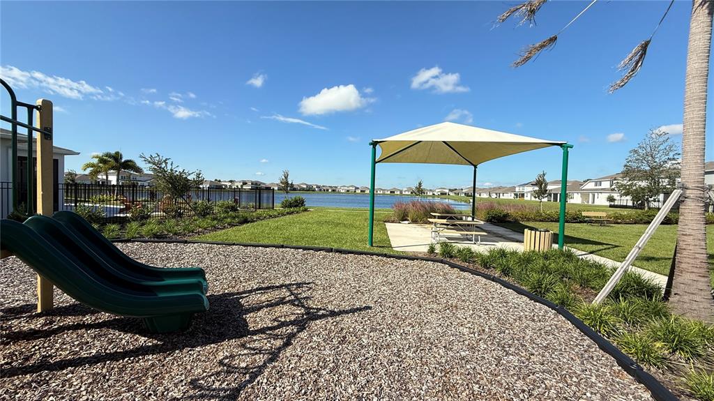 1530 Groveline Road St. Cloud, FL 34771 - Photo 16 of 18 a view of a garden with a patio